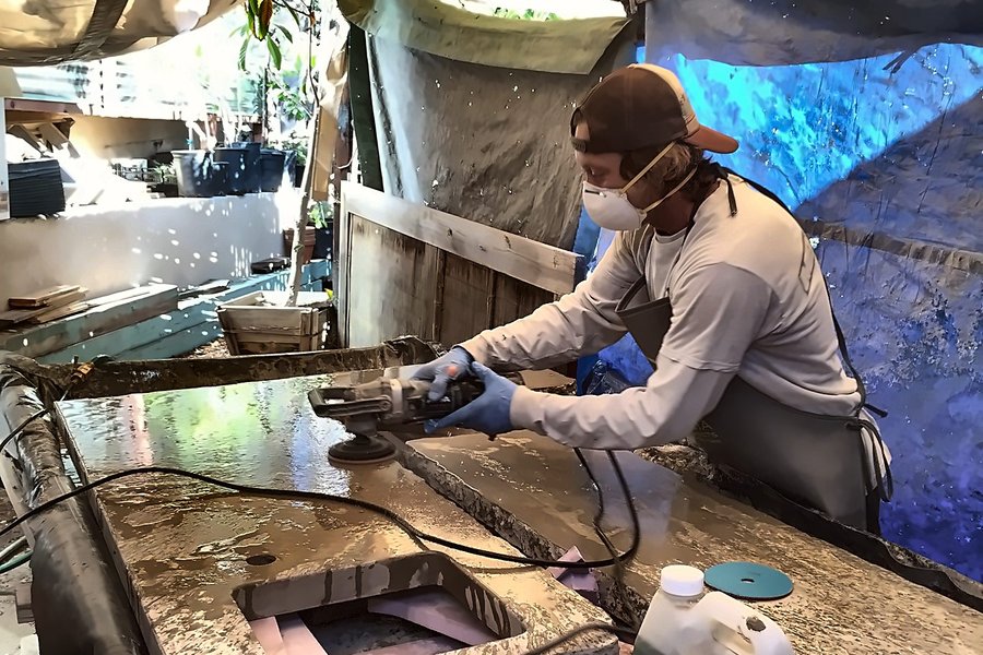 Hand-polishing a cast concrete counter